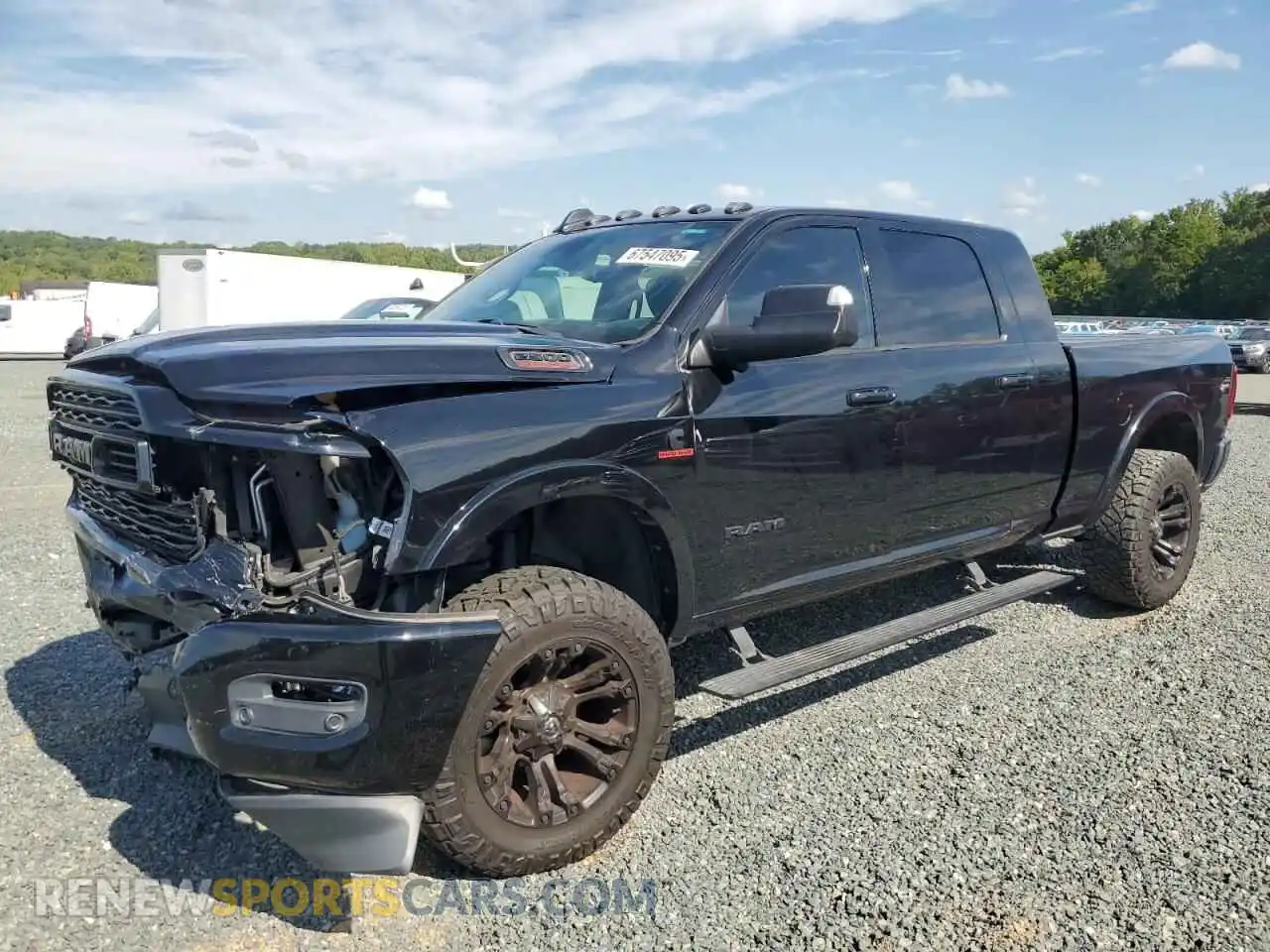 1 Photograph of a damaged car 3C6UR5TL6MG510064 RAM 2500 2021