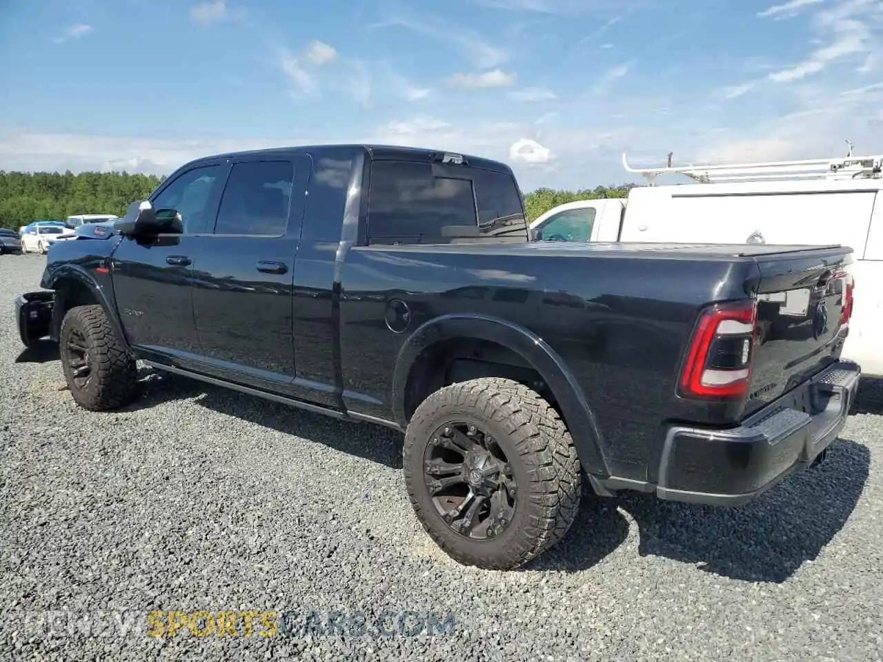 2 Photograph of a damaged car 3C6UR5TL6MG510064 RAM 2500 2021