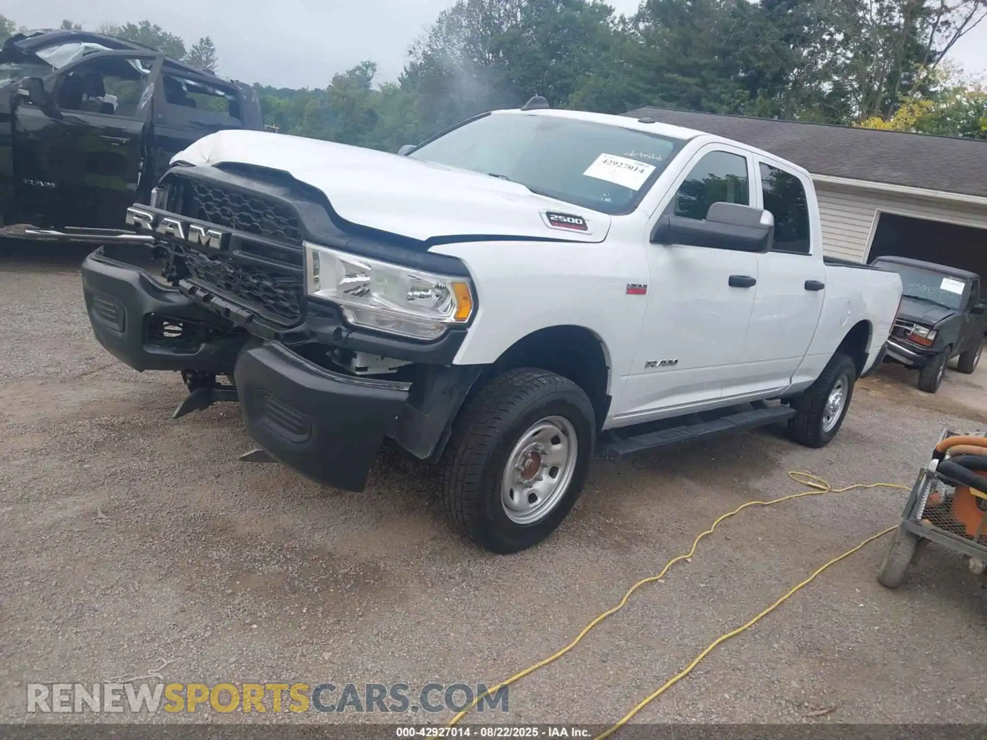 2 Photograph of a damaged car 3C6UR5CJ2NG232490 RAM 2500 2022