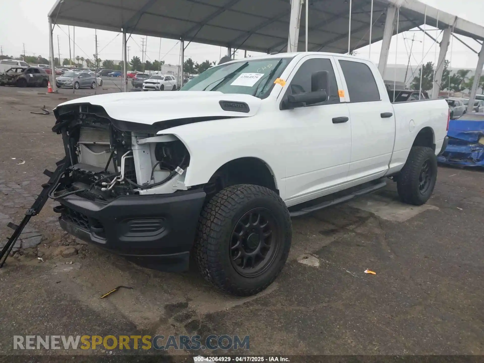 2 Photograph of a damaged car 3C6UR5CL1NG438188 RAM 2500 2022