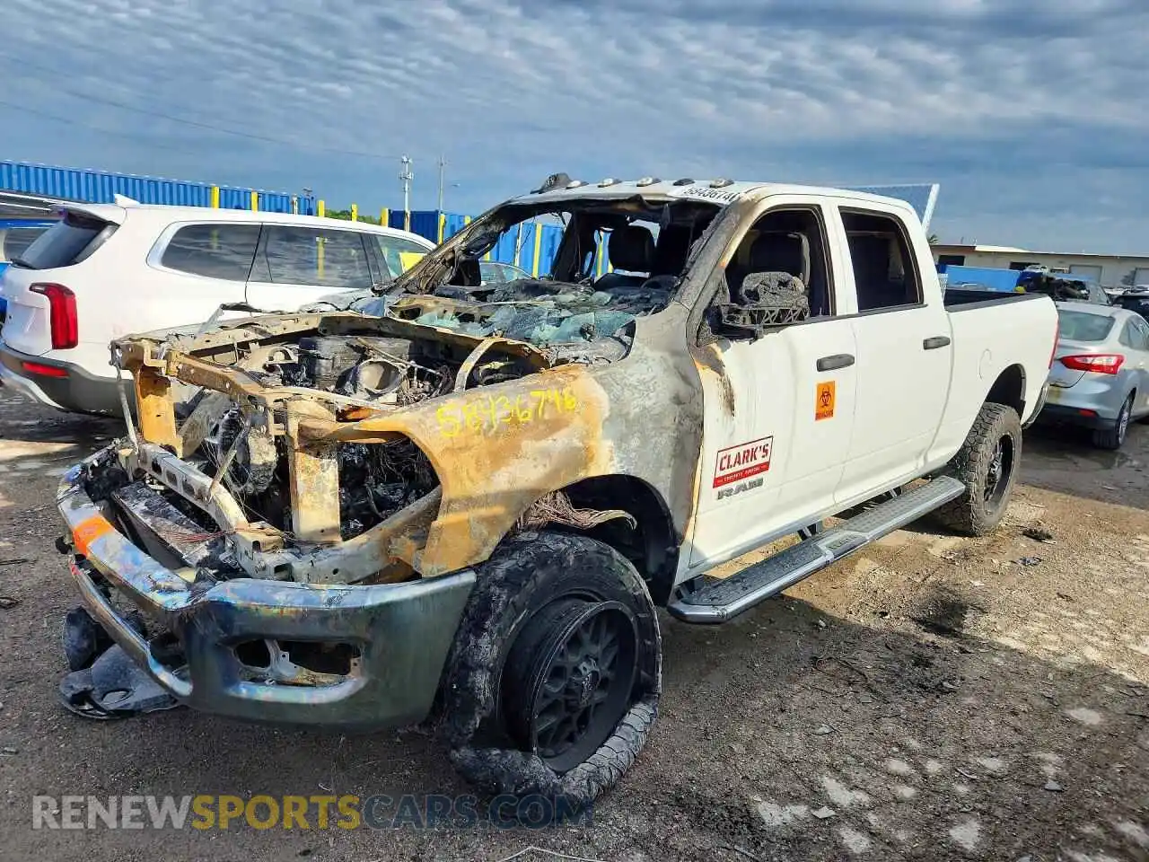 1 Photograph of a damaged car 3C6UR5CL6NG271293 RAM 2500 2022
