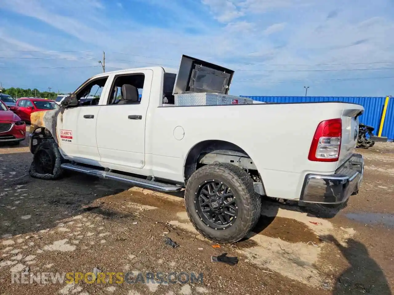 2 Photograph of a damaged car 3C6UR5CL6NG271293 RAM 2500 2022
