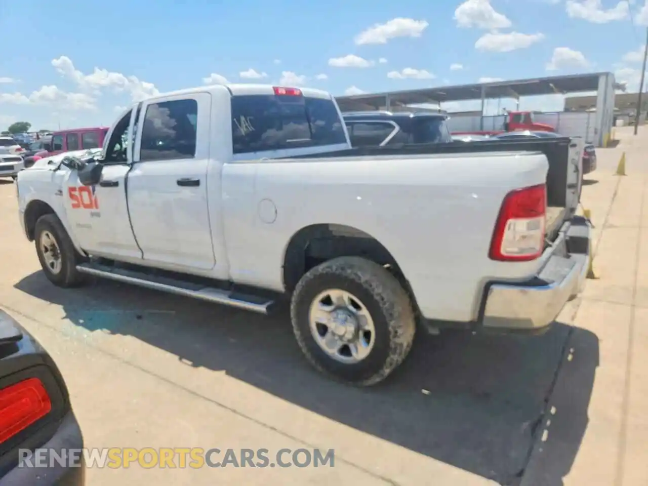 2 Photograph of a damaged car 3C6UR5CL7NG118969 RAM 2500 2022