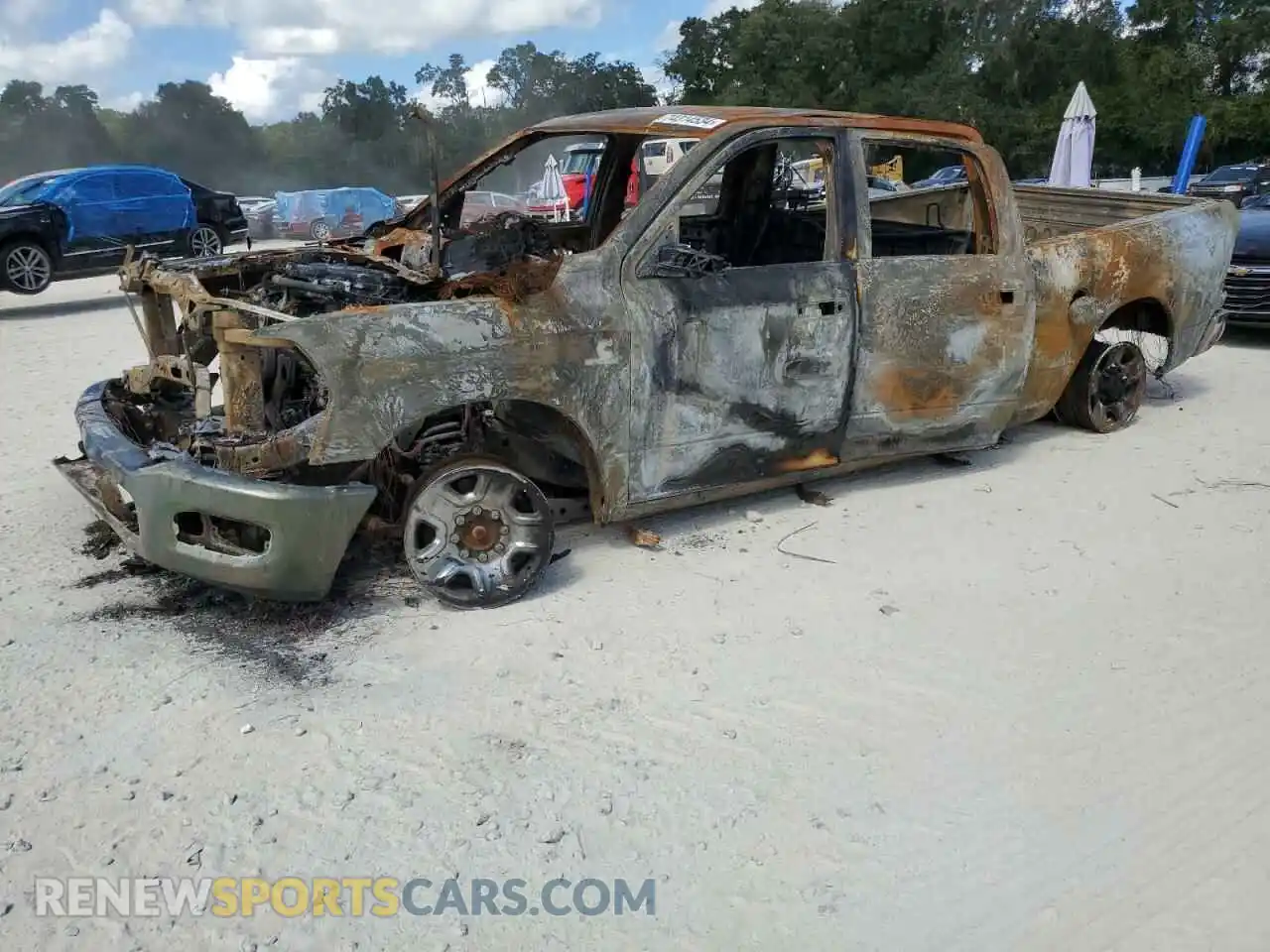 1 Photograph of a damaged car 3C6UR5CL7NG401288 RAM 2500 2022