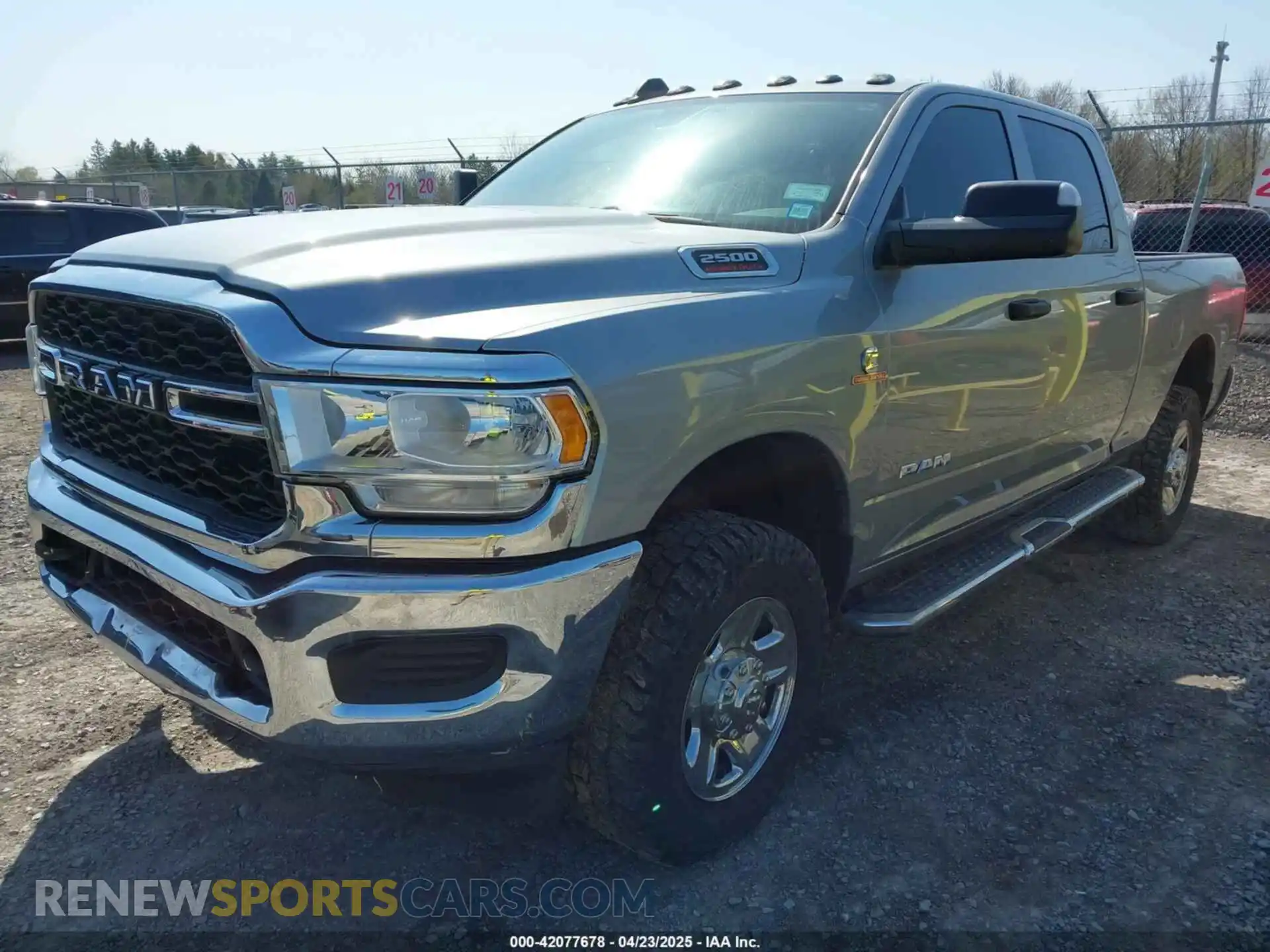 2 Photograph of a damaged car 3C6UR5CL8NG280660 RAM 2500 2022