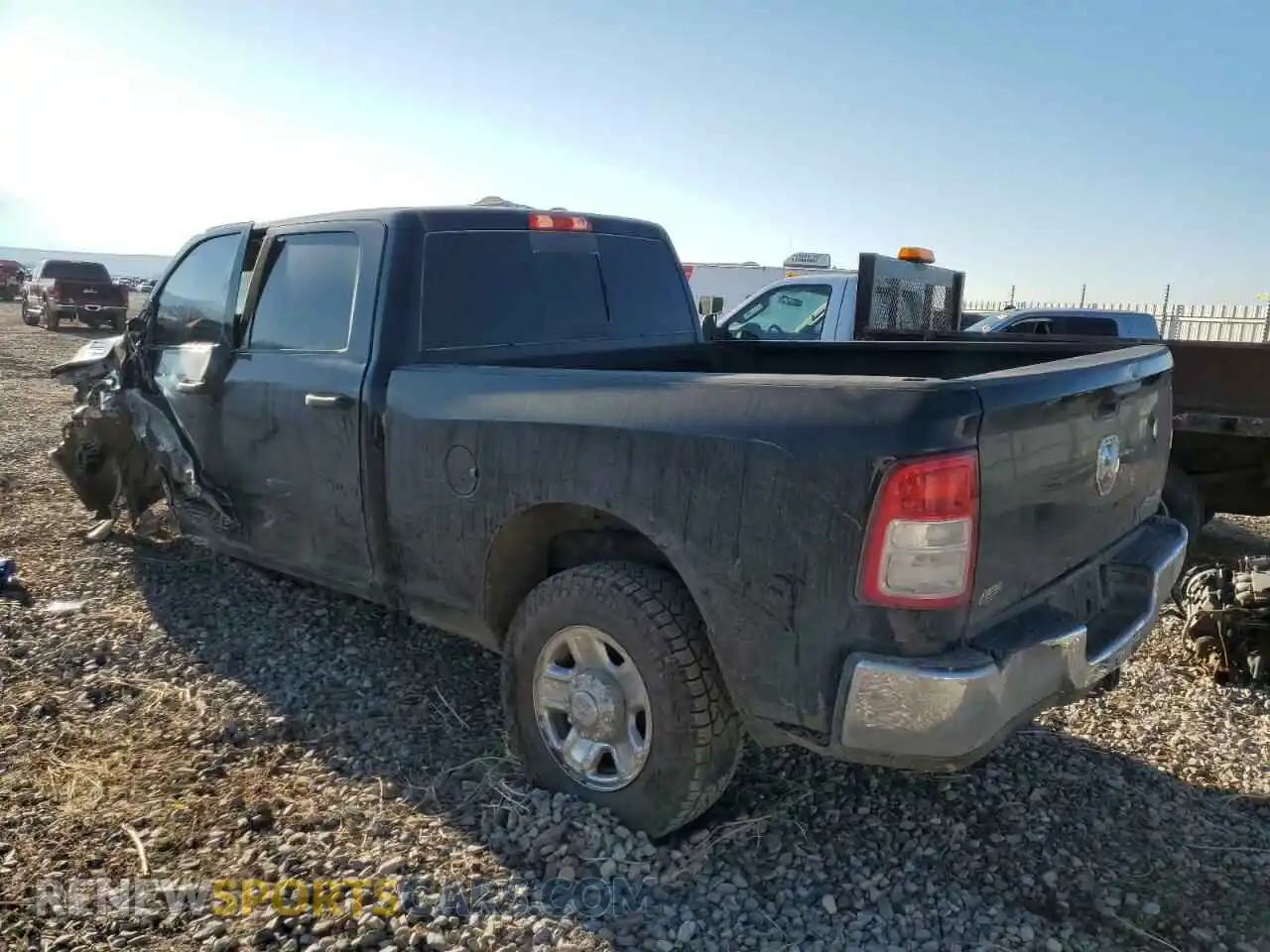 2 Photograph of a damaged car 3C6UR5CL8NG299323 RAM 2500 2022
