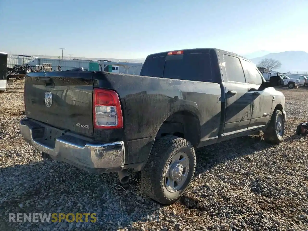 3 Photograph of a damaged car 3C6UR5CL8NG299323 RAM 2500 2022