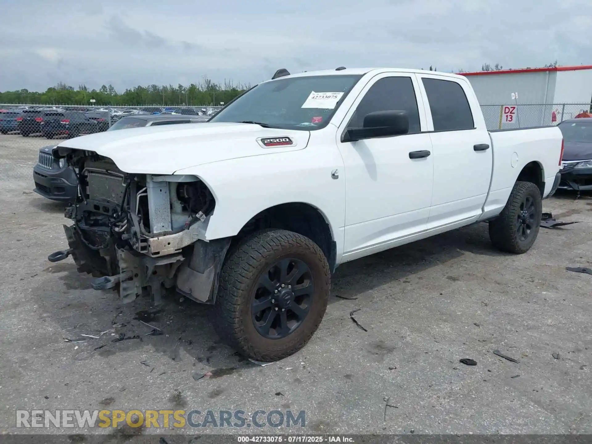 2 Photograph of a damaged car 3C6UR5CLXNG221366 RAM 2500 2022