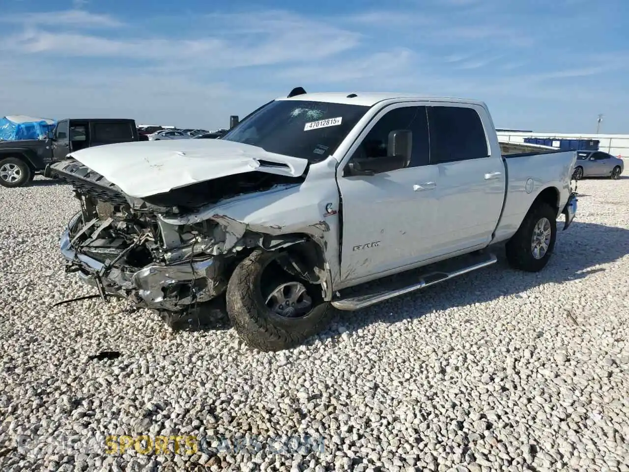 1 Photograph of a damaged car 3C6UR5DL0NG298052 RAM 2500 2022
