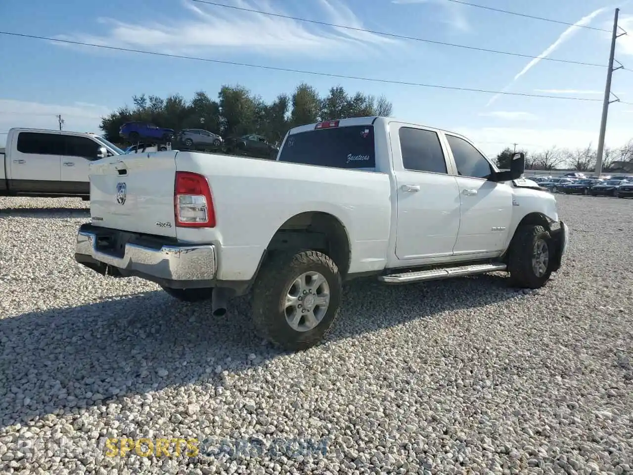 3 Photograph of a damaged car 3C6UR5DL0NG298052 RAM 2500 2022