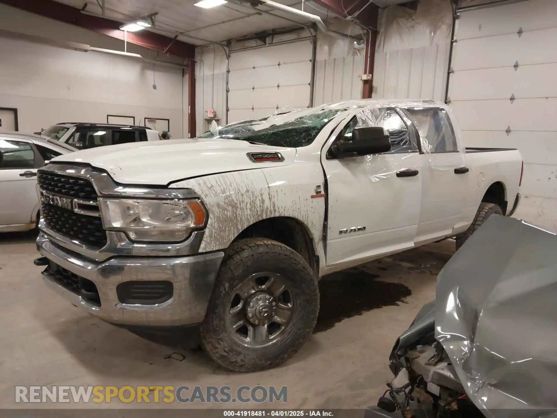 2 Photograph of a damaged car 3C6UR5DL1NG336663 RAM 2500 2022