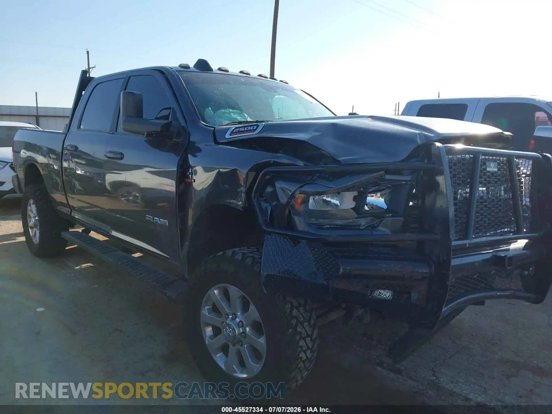 1 Photograph of a damaged car 3C6UR5DL2NG128937 RAM 2500 2022