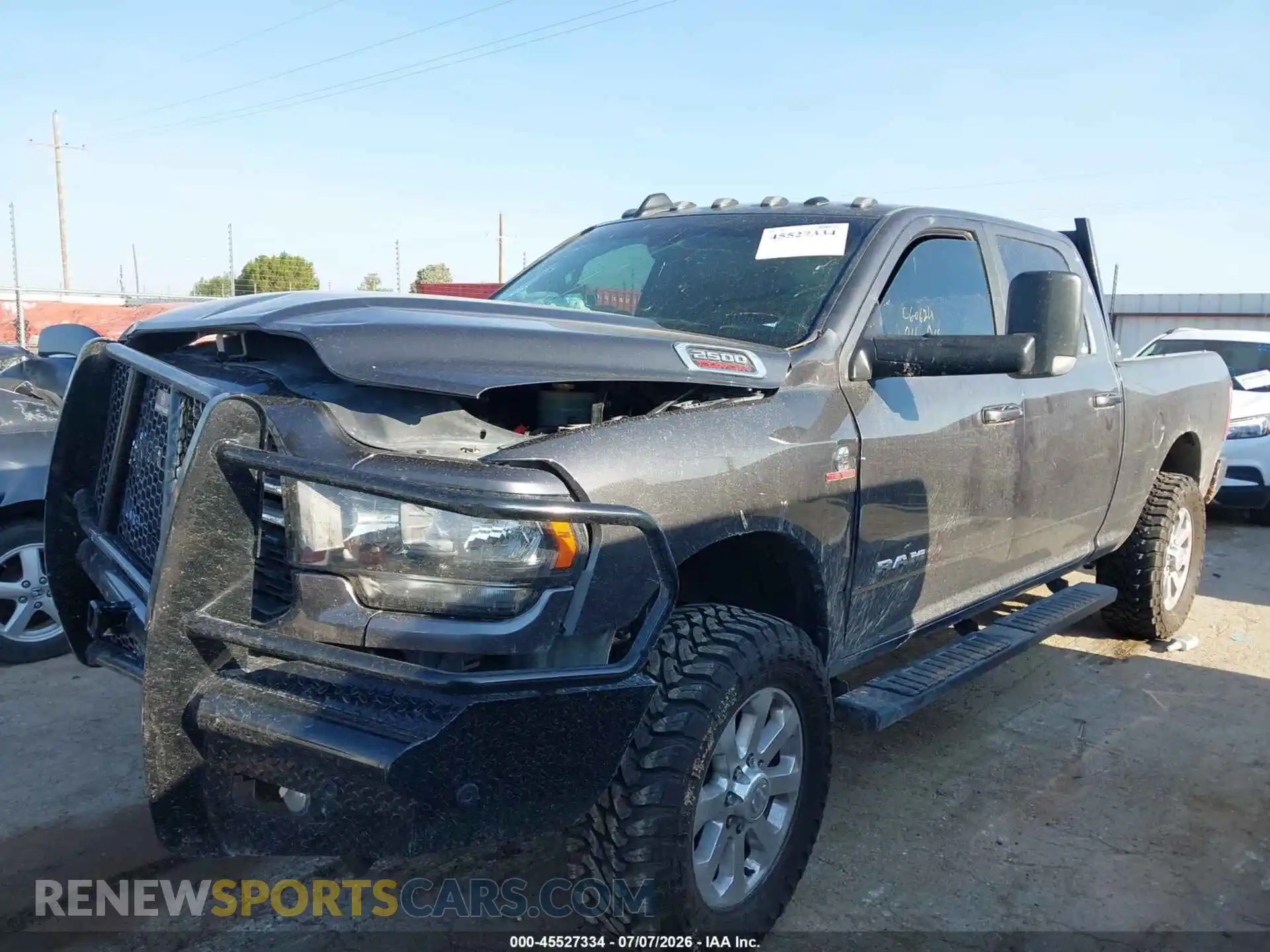 2 Photograph of a damaged car 3C6UR5DL2NG128937 RAM 2500 2022
