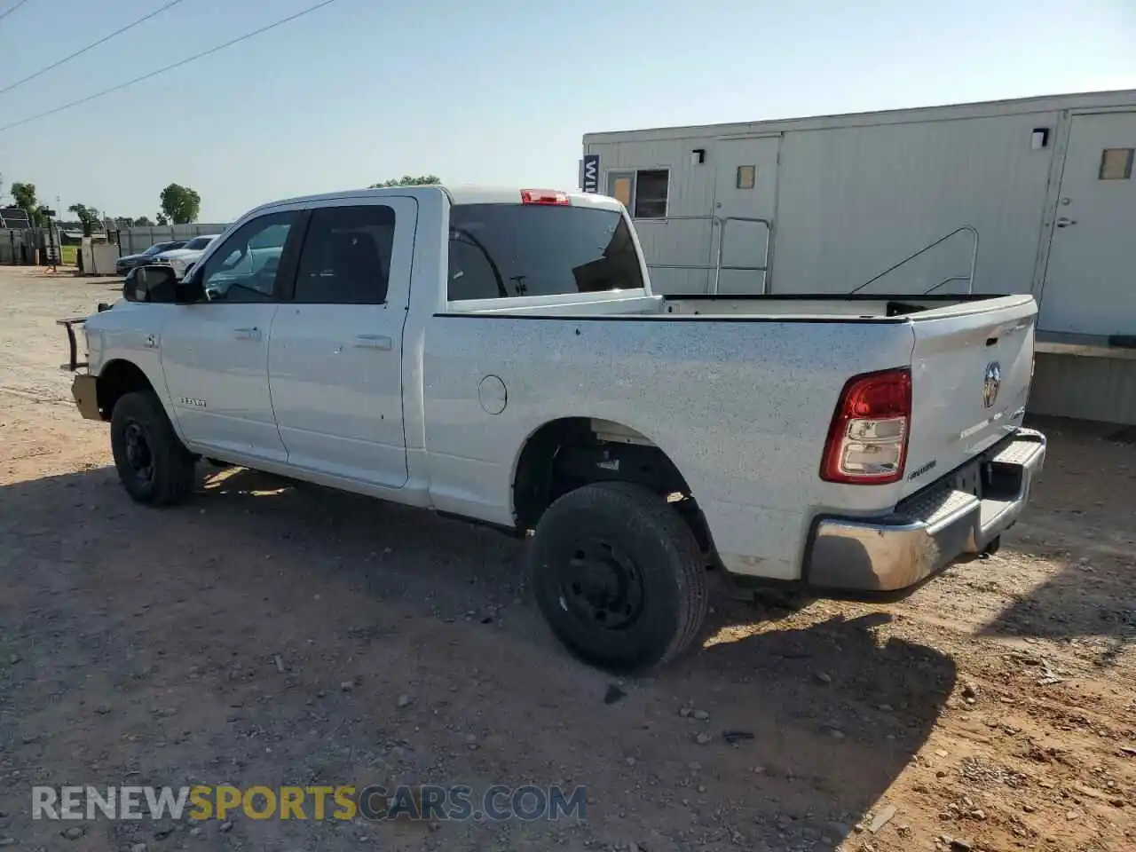 2 Photograph of a damaged car 3C6UR5DL3NG322697 RAM 2500 2022