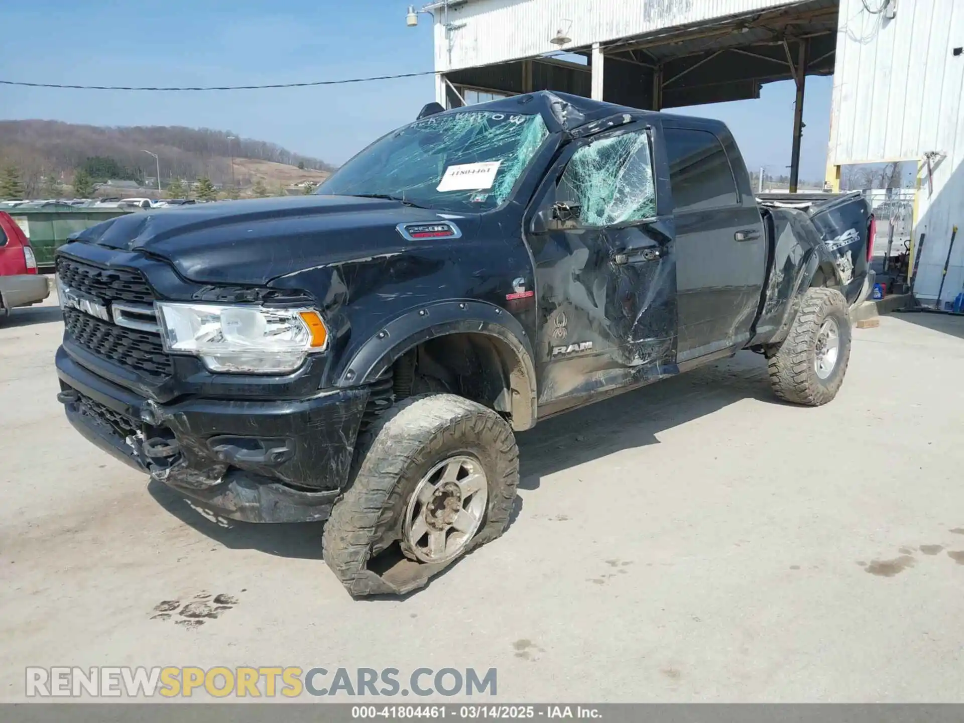 2 Photograph of a damaged car 3C6UR5DL3NG382141 RAM 2500 2022