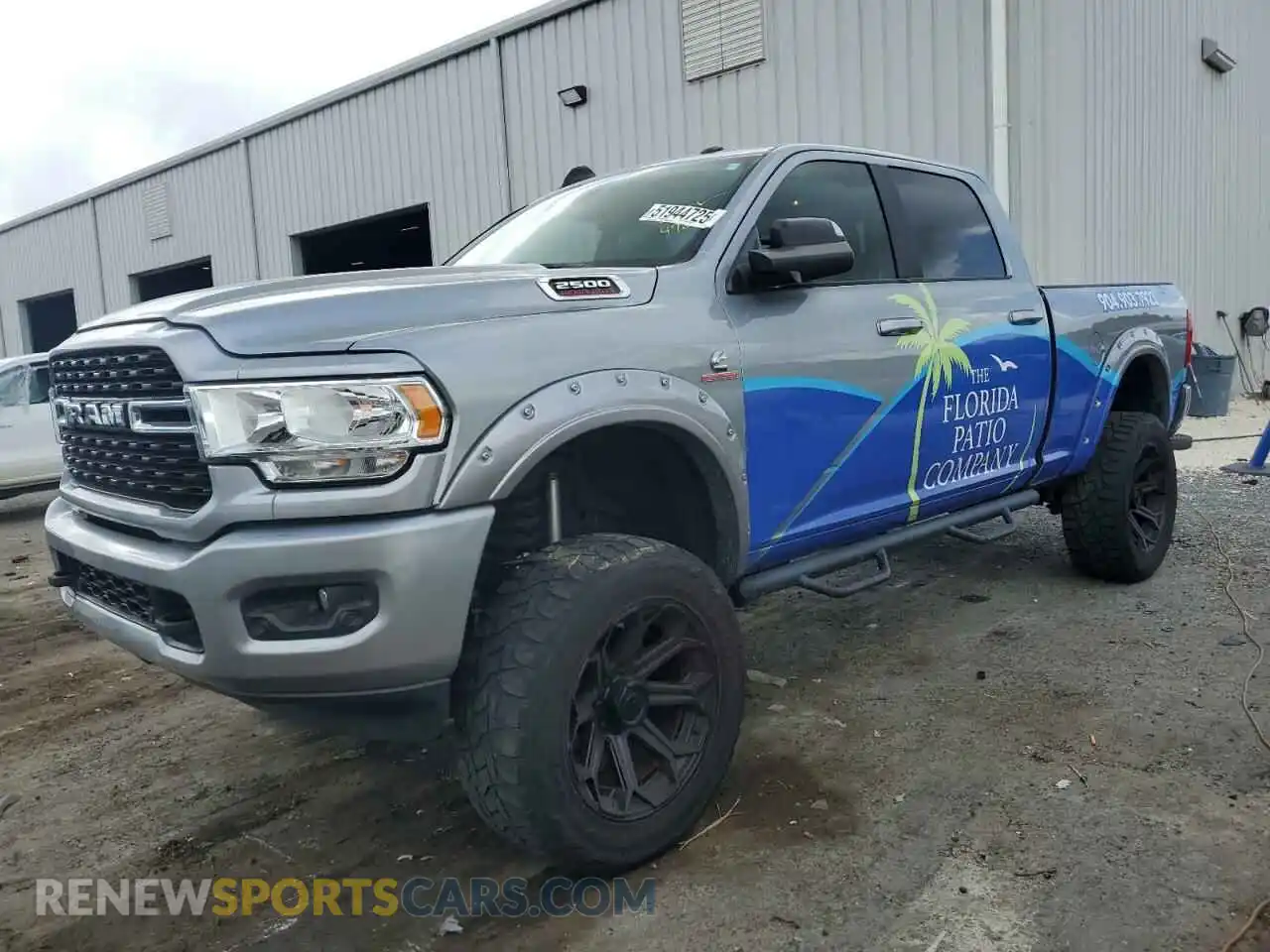 1 Photograph of a damaged car 3C6UR5DL4NG105952 RAM 2500 2022