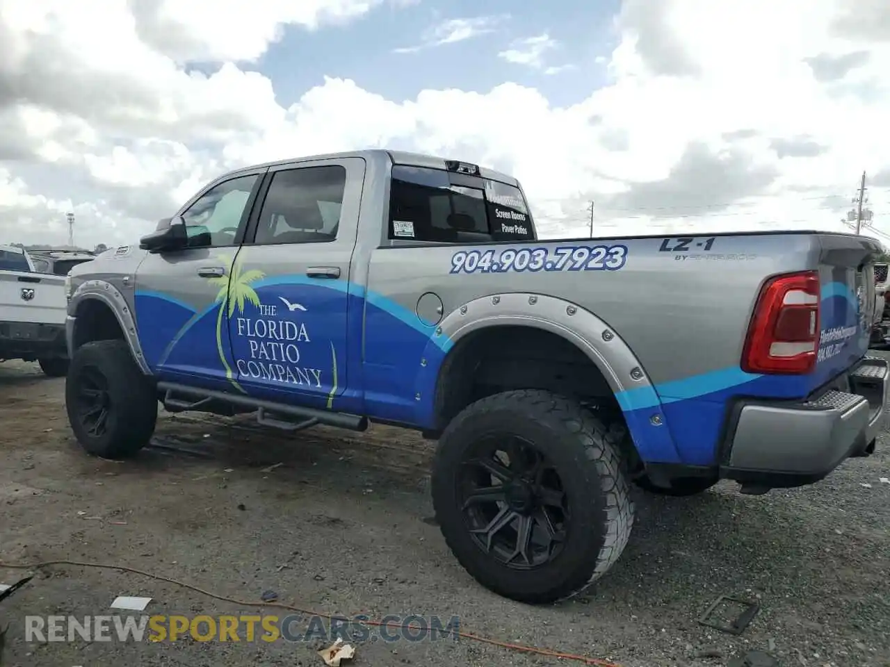 2 Photograph of a damaged car 3C6UR5DL4NG105952 RAM 2500 2022
