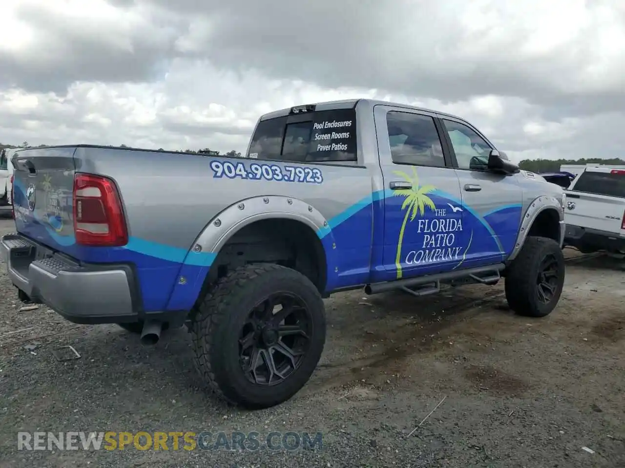 3 Photograph of a damaged car 3C6UR5DL4NG105952 RAM 2500 2022
