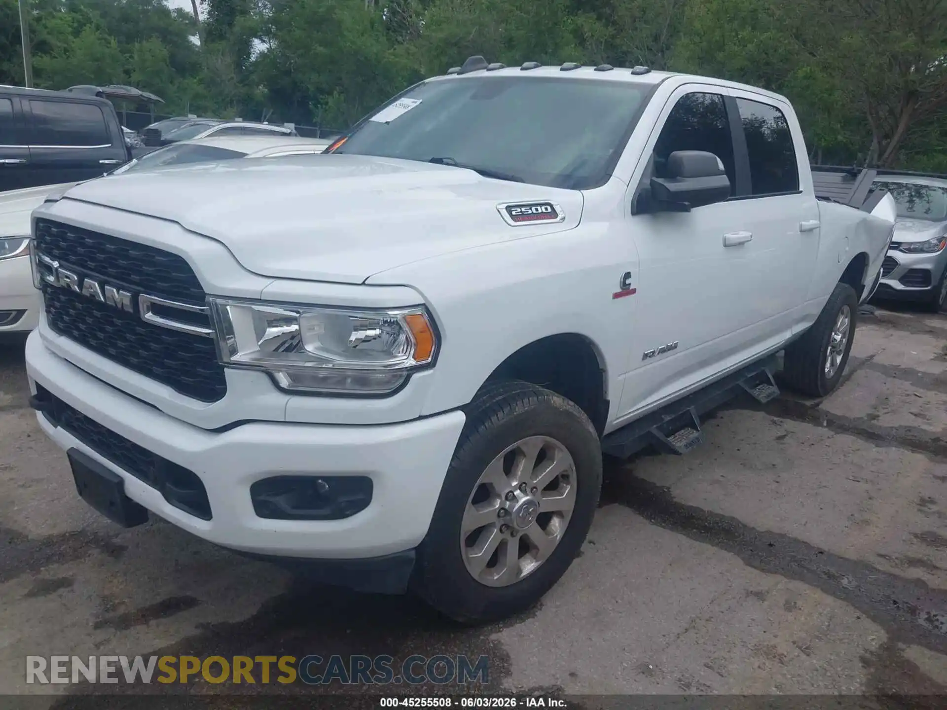 2 Photograph of a damaged car 3C6UR5DL5NG111775 RAM 2500 2022