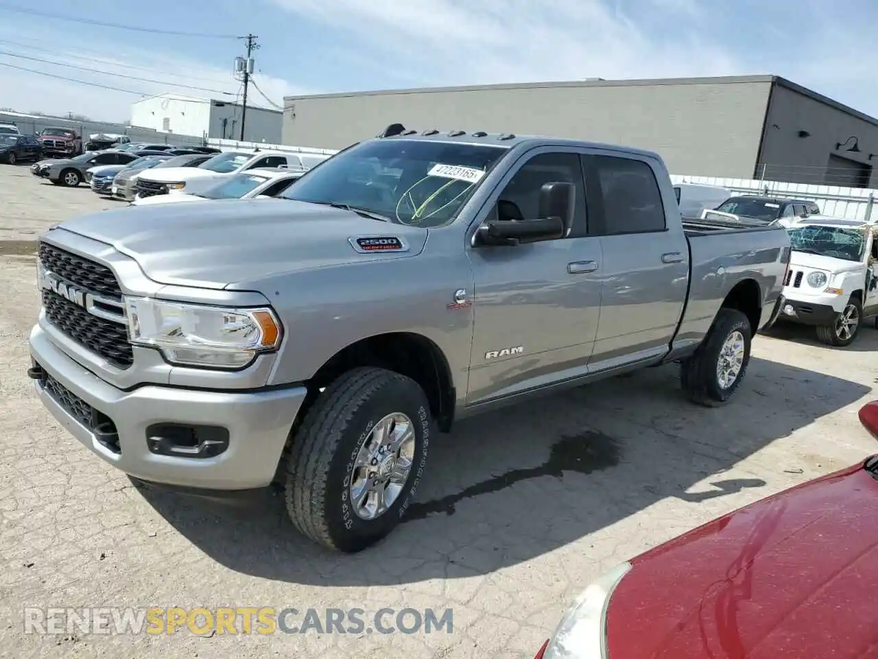1 Photograph of a damaged car 3C6UR5DL5NG147112 RAM 2500 2022