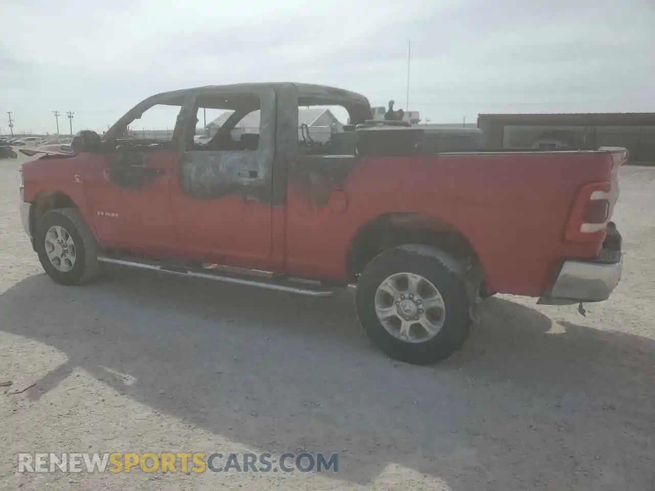 2 Photograph of a damaged car 3C6UR5DL5NG360836 RAM 2500 2022