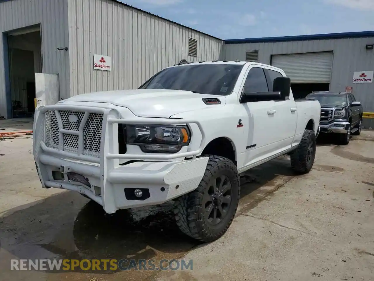 1 Photograph of a damaged car 3C6UR5DL5NG394811 RAM 2500 2022