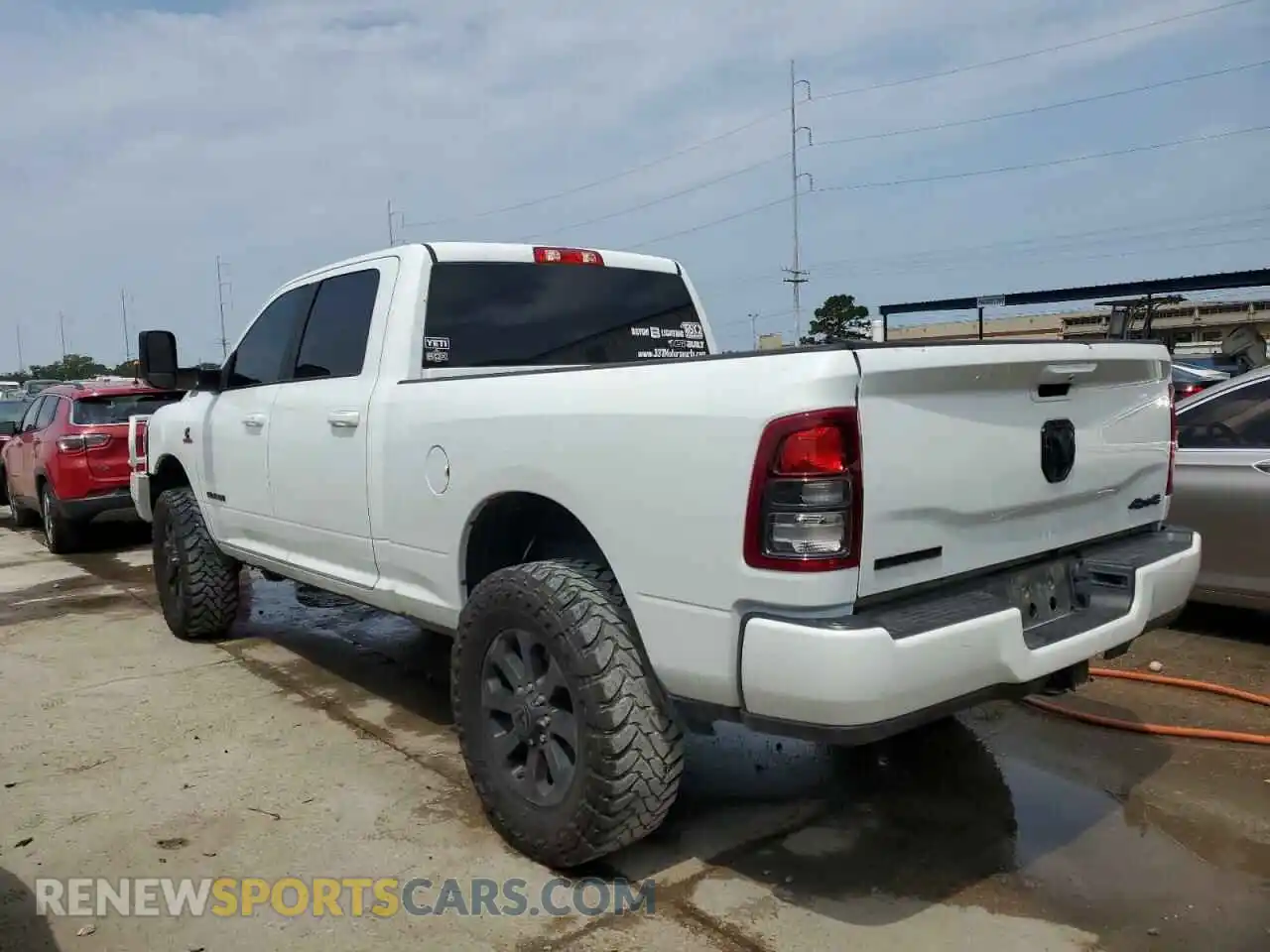 2 Photograph of a damaged car 3C6UR5DL5NG394811 RAM 2500 2022
