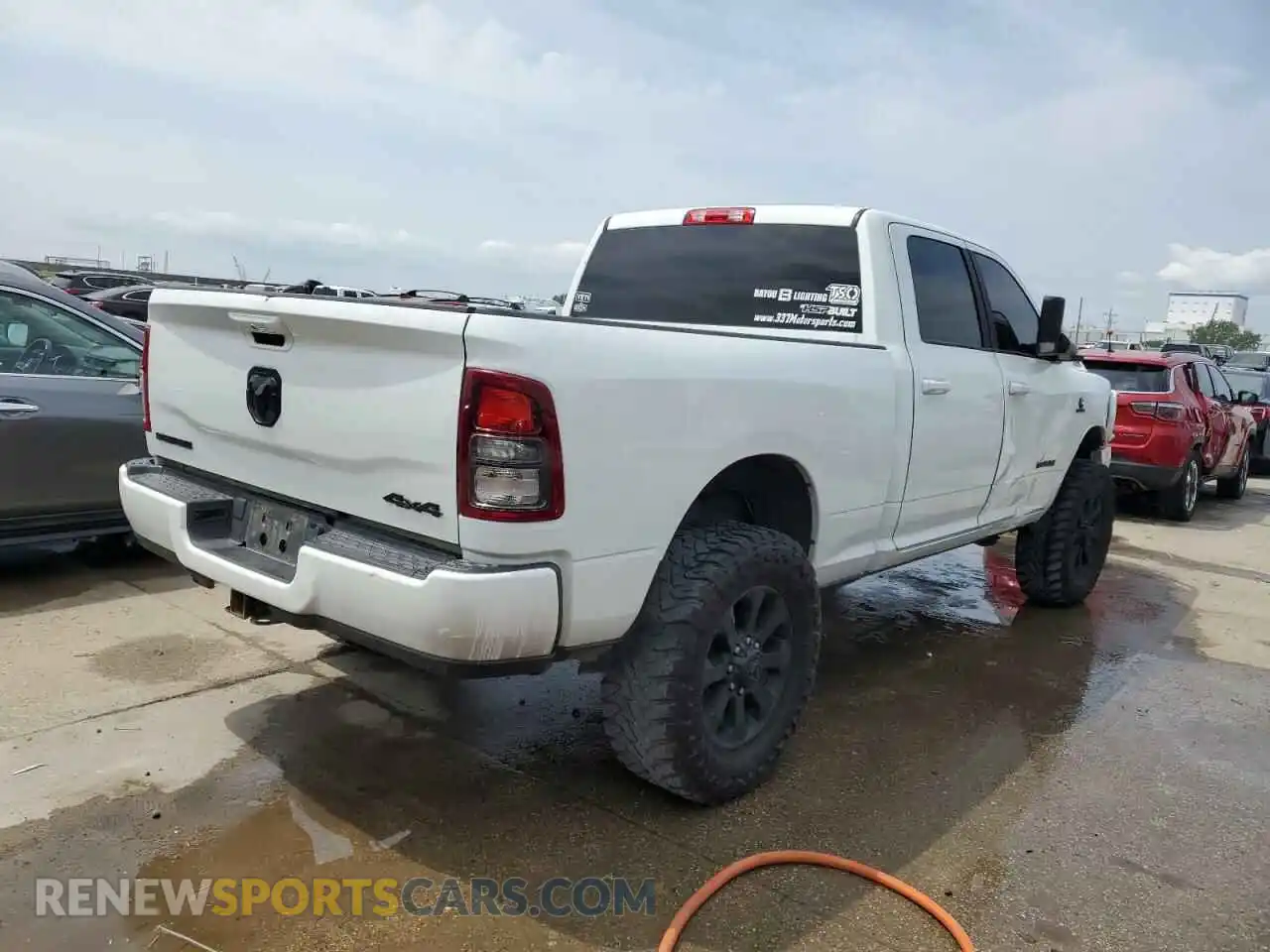 3 Photograph of a damaged car 3C6UR5DL5NG394811 RAM 2500 2022