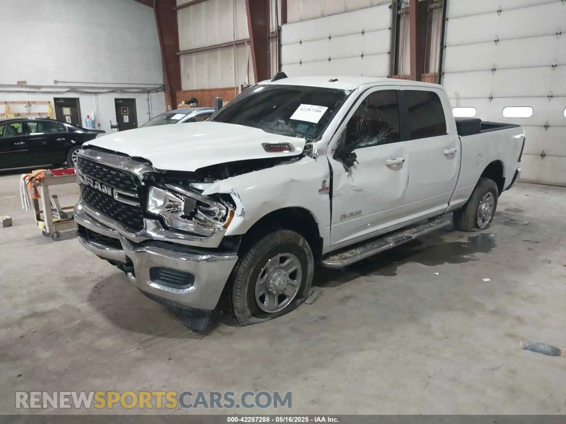 2 Photograph of a damaged car 3C6UR5DL6NG436791 RAM 2500 2022