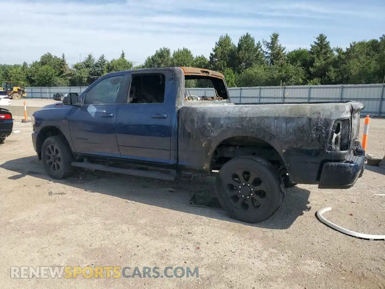 2 Photograph of a damaged car 3C6UR5DL7NG131137 RAM 2500 2022