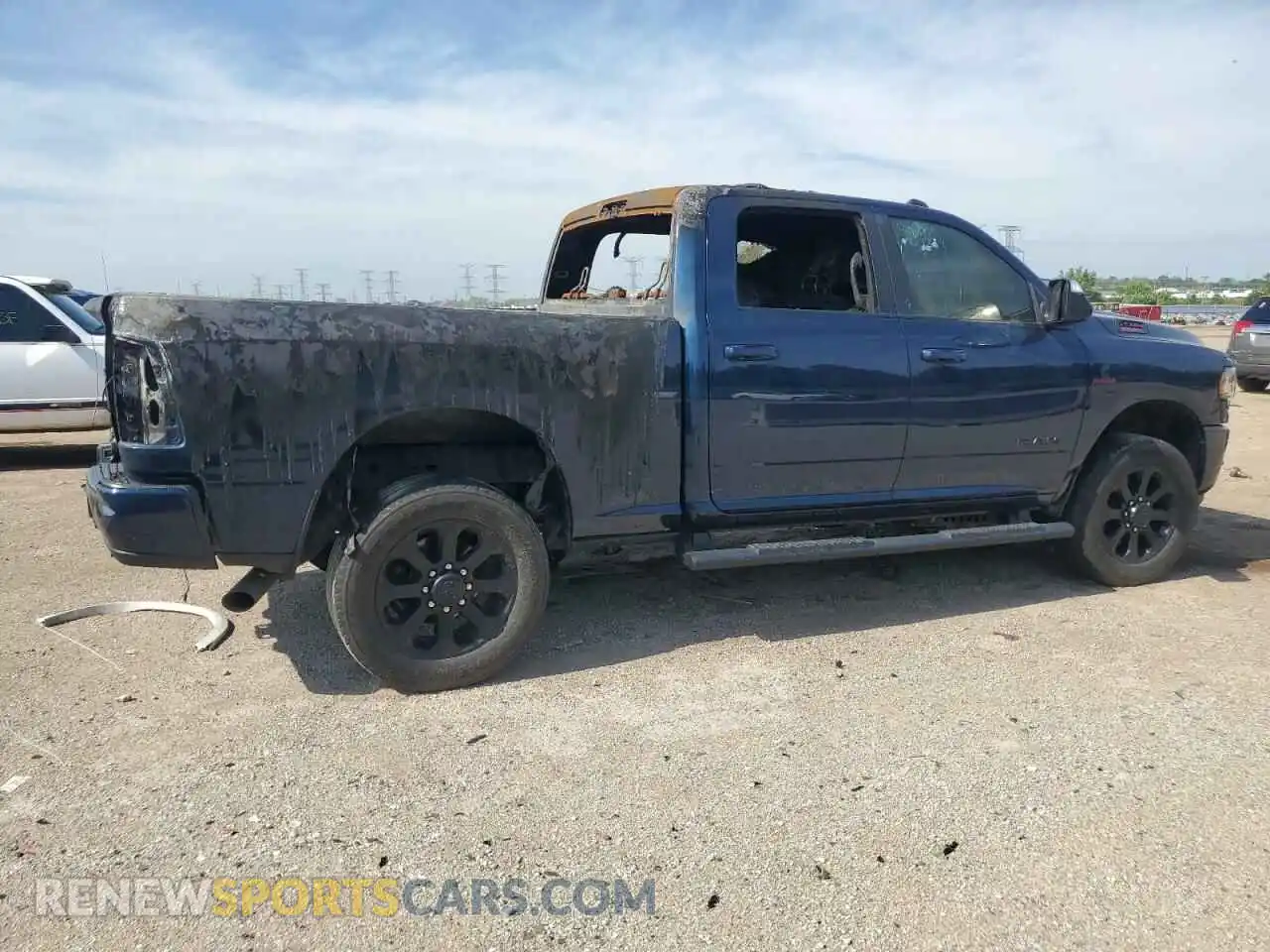 3 Photograph of a damaged car 3C6UR5DL7NG131137 RAM 2500 2022