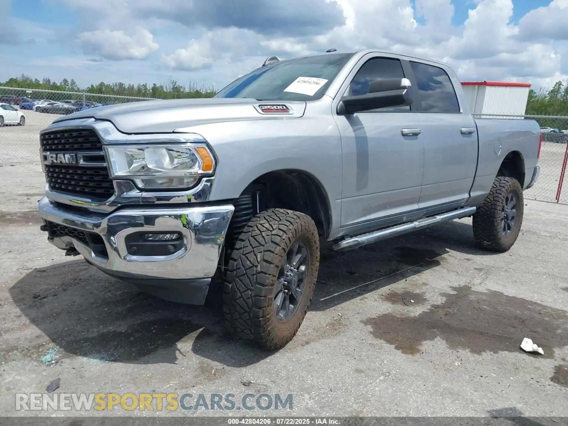 2 Photograph of a damaged car 3C6UR5DL8NG103847 RAM 2500 2022