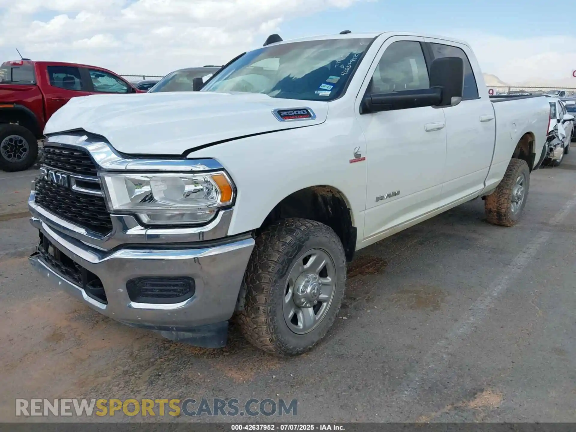 2 Photograph of a damaged car 3C6UR5DL8NG365559 RAM 2500 2022