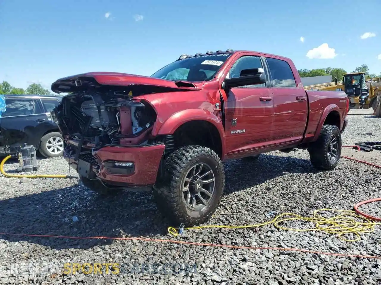 1 Photograph of a damaged car 3C6UR5DL9NG185880 RAM 2500 2022