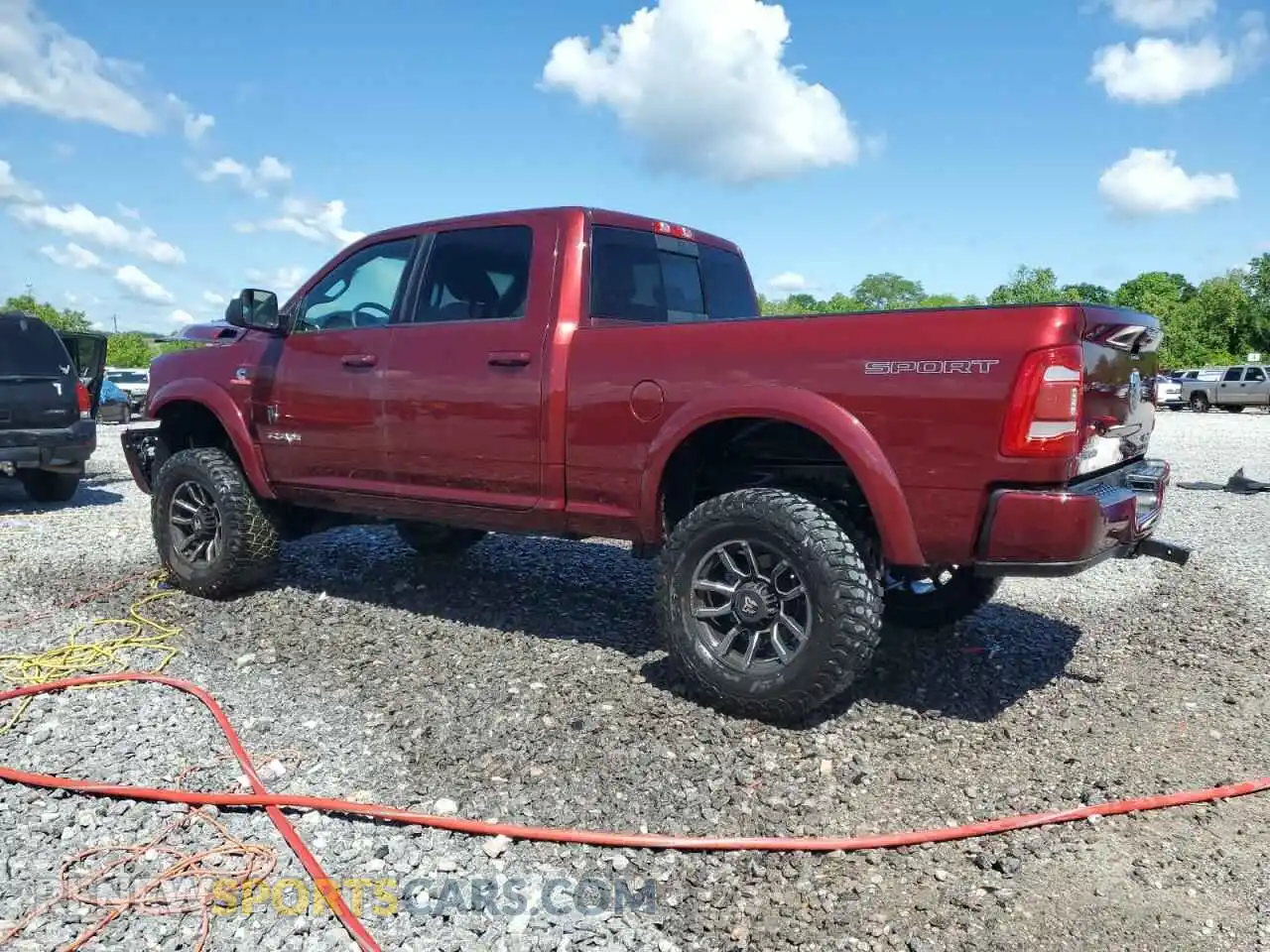 2 Photograph of a damaged car 3C6UR5DL9NG185880 RAM 2500 2022