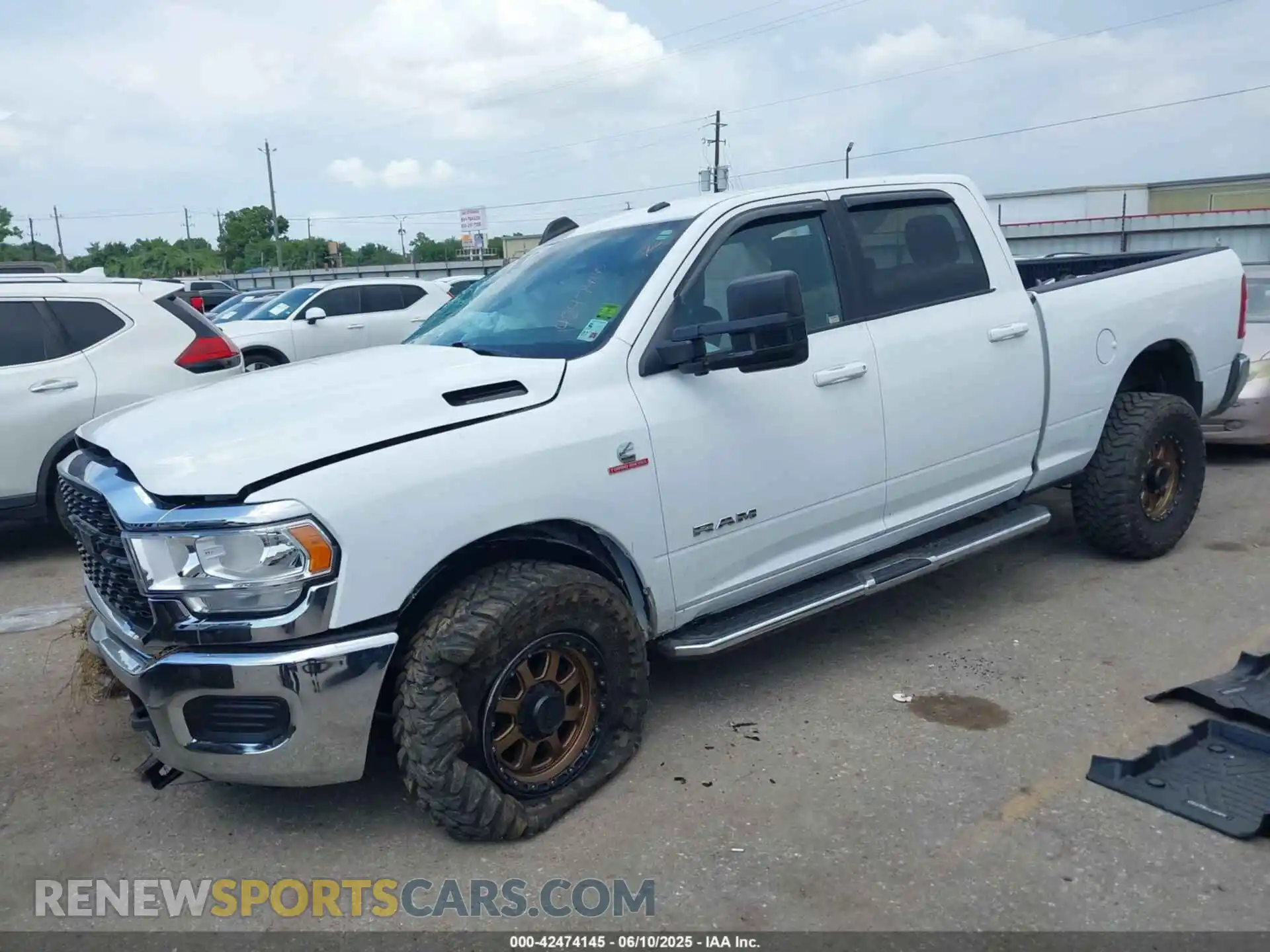 2 Photograph of a damaged car 3C6UR5DLXNG436311 RAM 2500 2022
