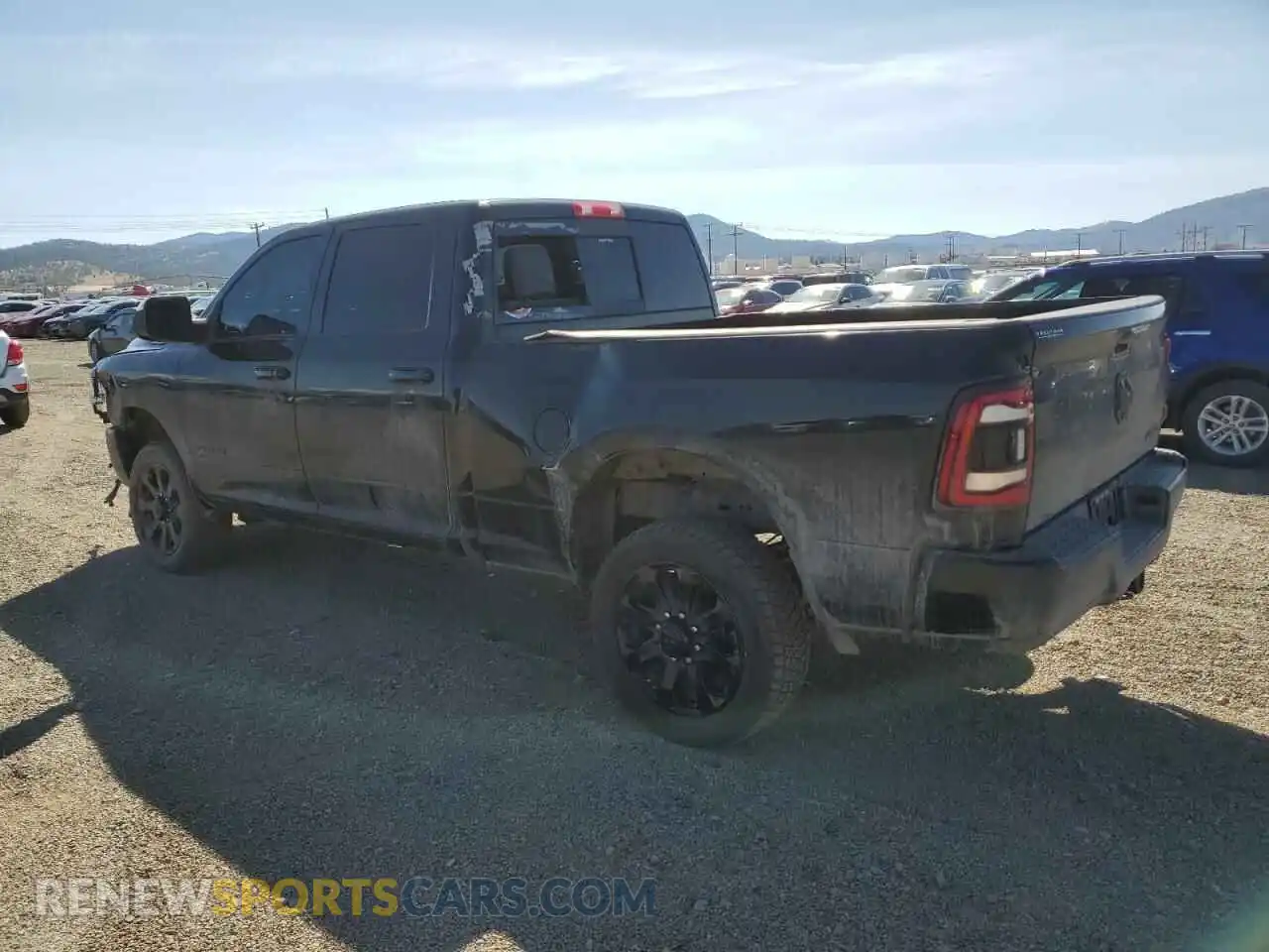 2 Photograph of a damaged car 3C6UR5FL1NG335574 RAM 2500 2022