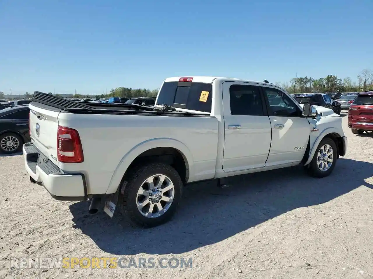 3 Photograph of a damaged car 3C6UR5FL5NG145499 RAM 2500 2022