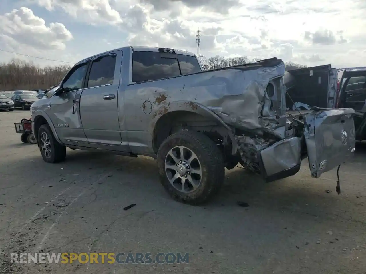 2 Photograph of a damaged car 3C6UR5GL8NG143082 RAM 2500 2022