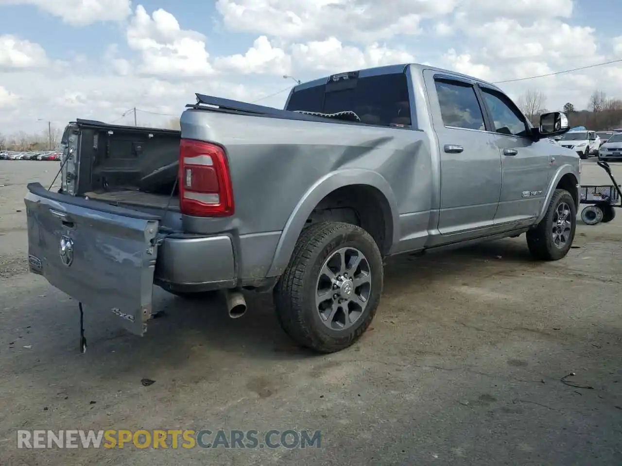 3 Photograph of a damaged car 3C6UR5GL8NG143082 RAM 2500 2022