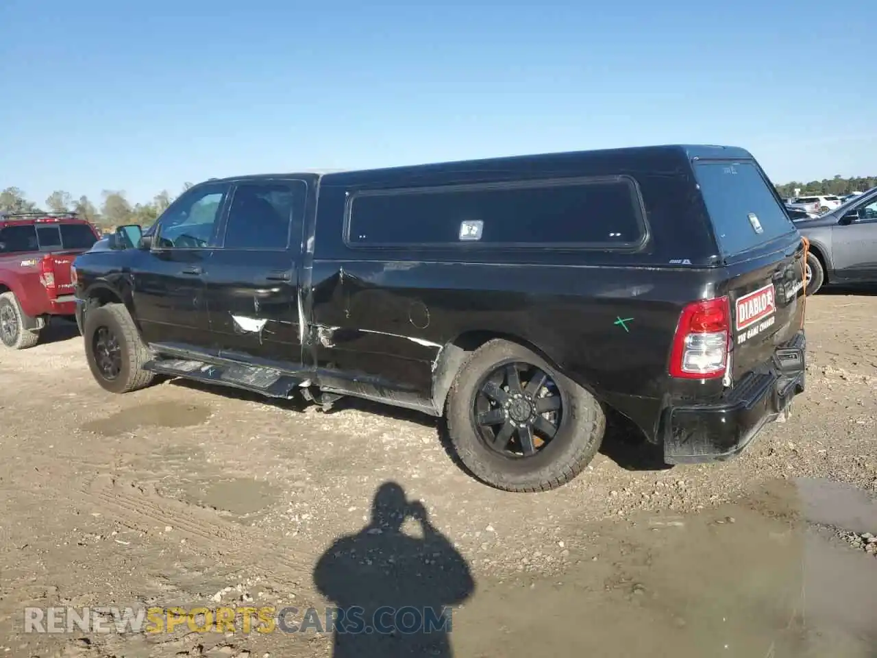 2 Photograph of a damaged car 3C6UR5HJ9NG423994 RAM 2500 2022