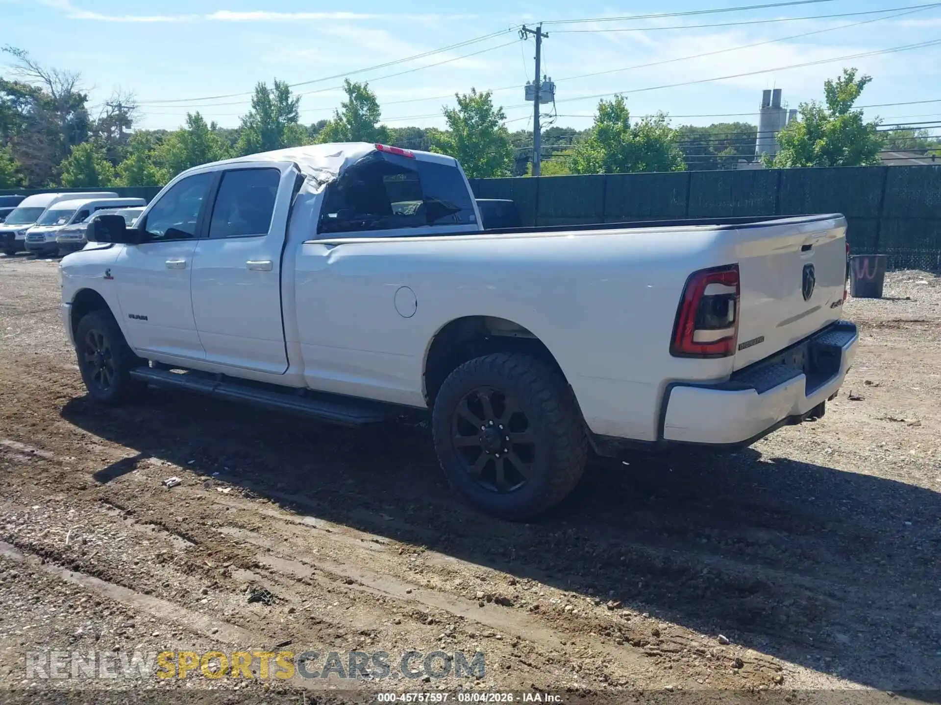 3 Photograph of a damaged car 3C6UR5JL0NG102423 RAM 2500 2022
