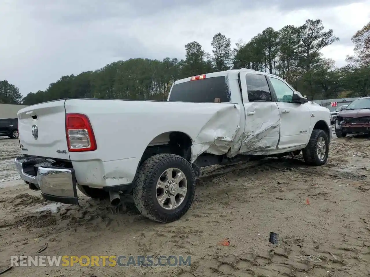 3 Photograph of a damaged car 3C6UR5JL4NG156579 RAM 2500 2022