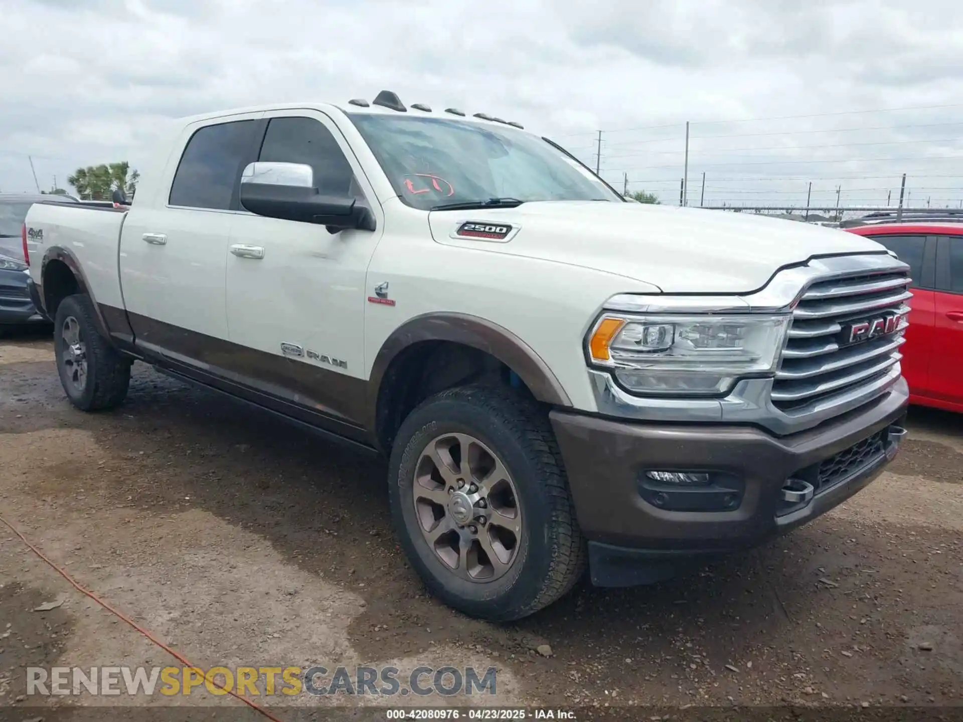 1 Photograph of a damaged car 3C6UR5PL9NG261593 RAM 2500 2022