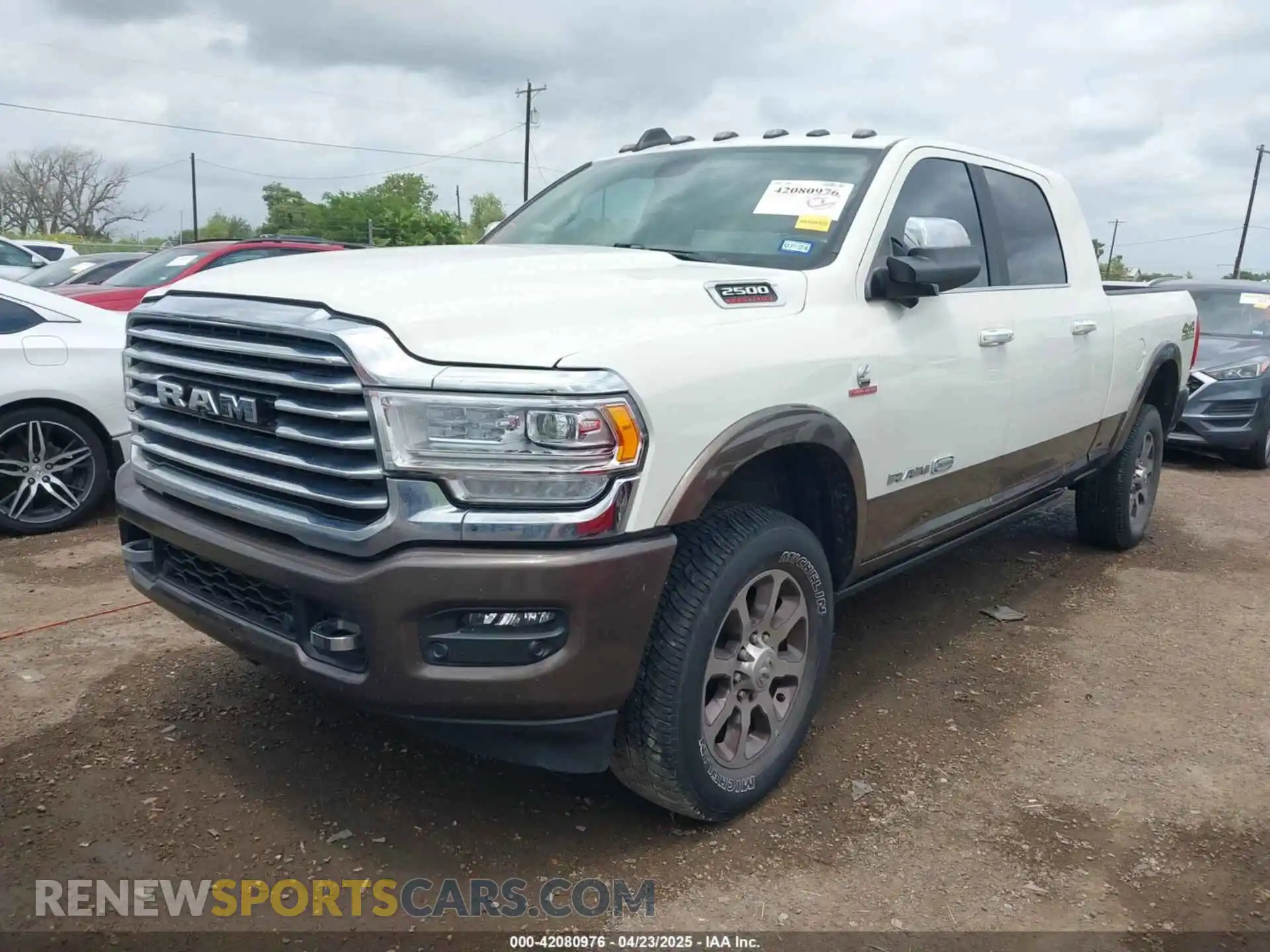 2 Photograph of a damaged car 3C6UR5PL9NG261593 RAM 2500 2022