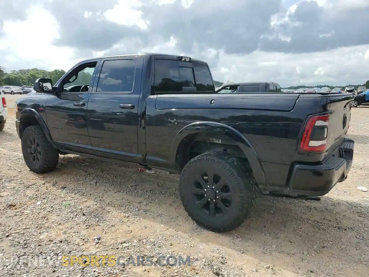 2 Photograph of a damaged car 3C6UR5SL5NG185989 RAM 2500 2022