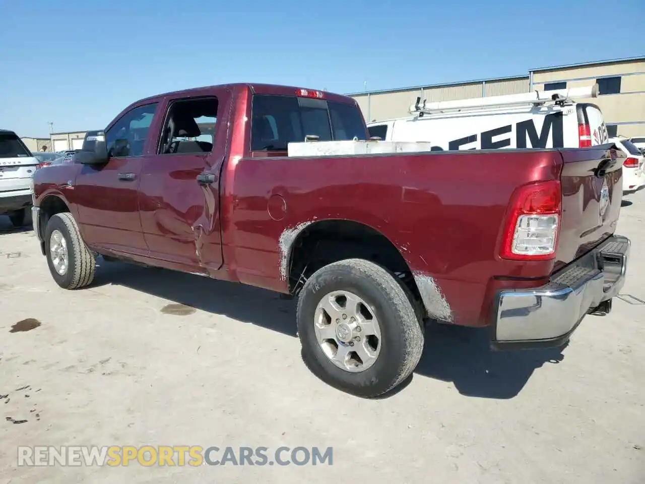 2 Photograph of a damaged car 3C6UR5CL1PG504080 RAM 2500 2023
