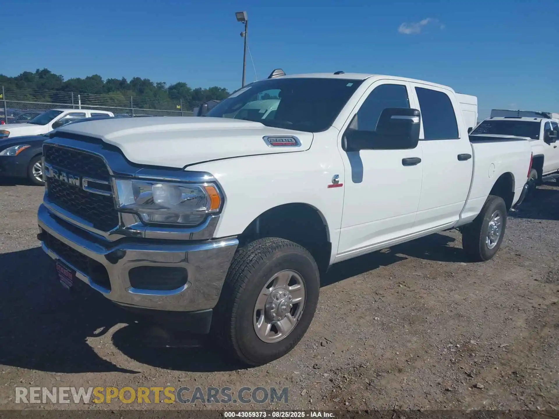 2 Photograph of a damaged car 3C6UR5CL2PG502757 RAM 2500 2023