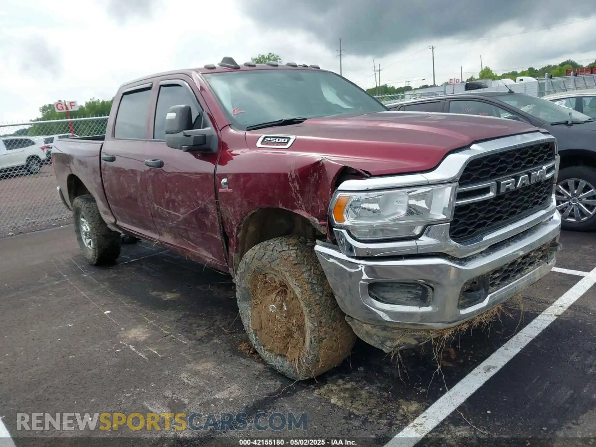 1 Photograph of a damaged car 3C6UR5CL3PG504534 RAM 2500 2023
