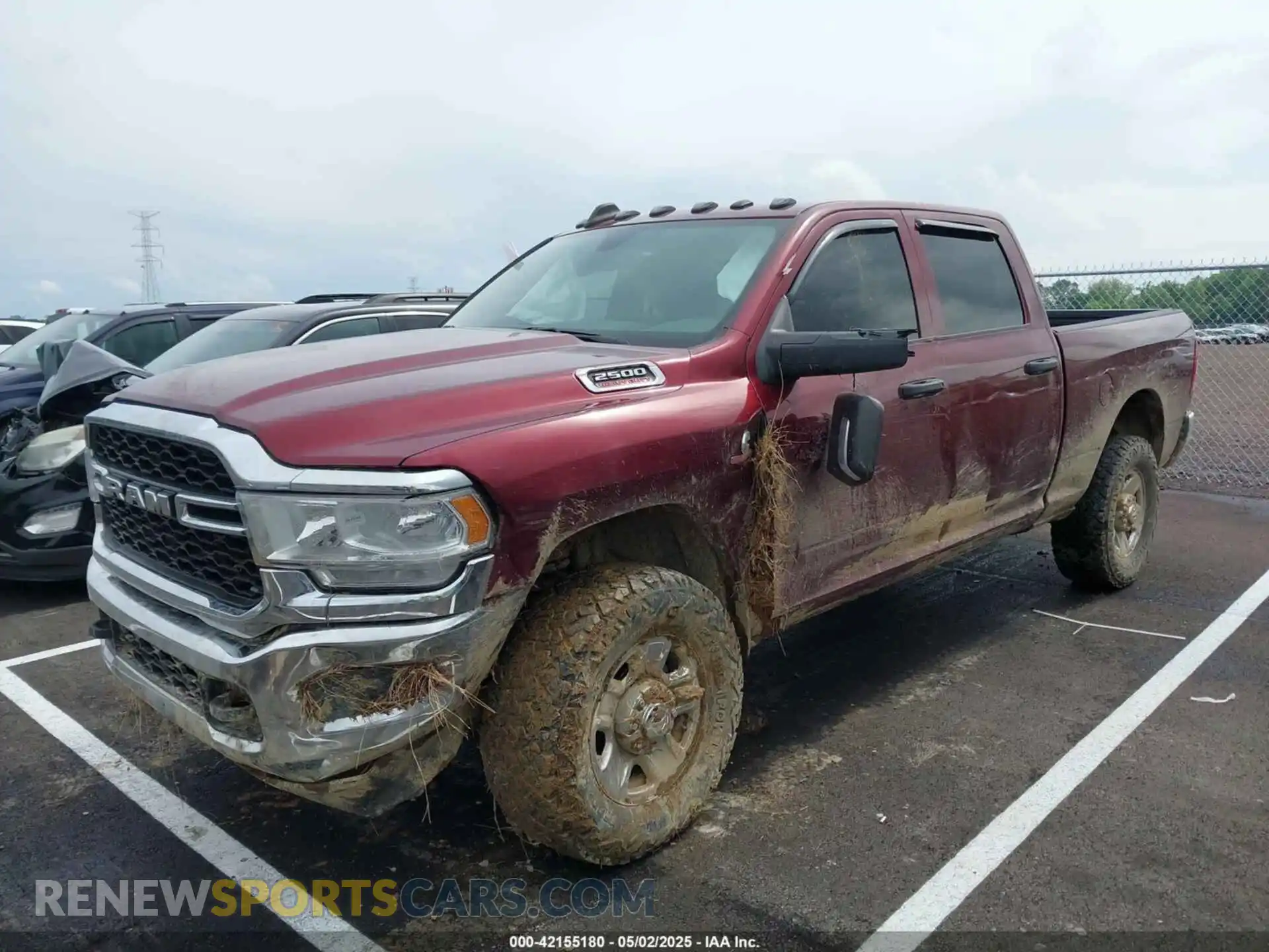 2 Photograph of a damaged car 3C6UR5CL3PG504534 RAM 2500 2023